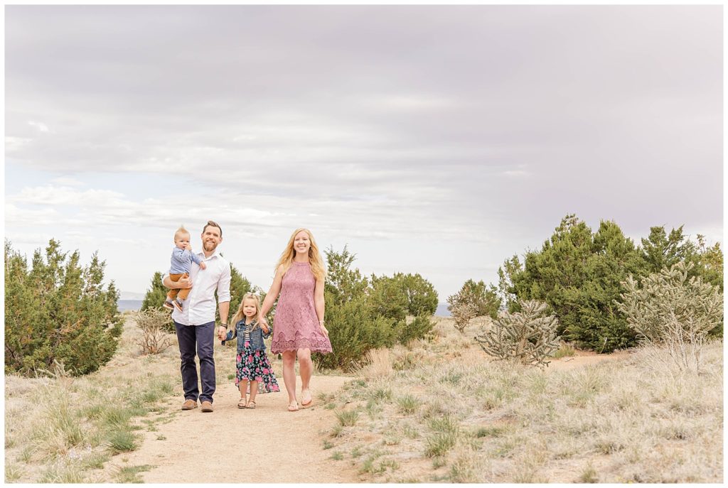 Family of four on the trails at an Albuquerque Family Photography session.