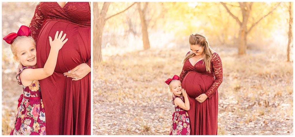Big sister hugs her mom's belly during a military maternity session