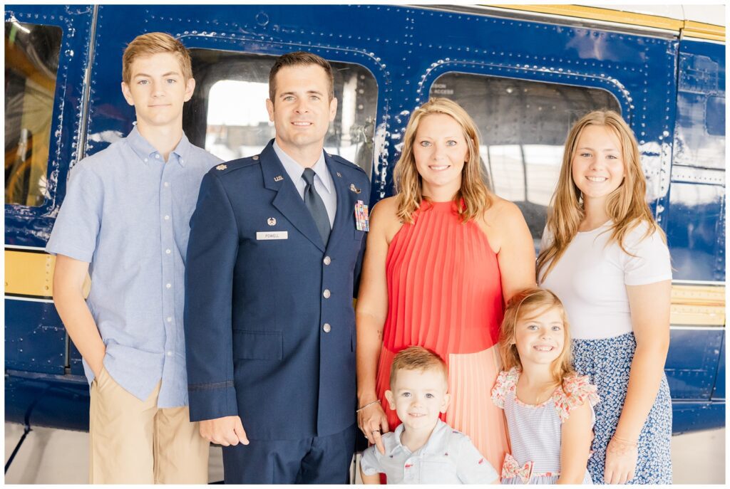 Family photo in front of the Huey