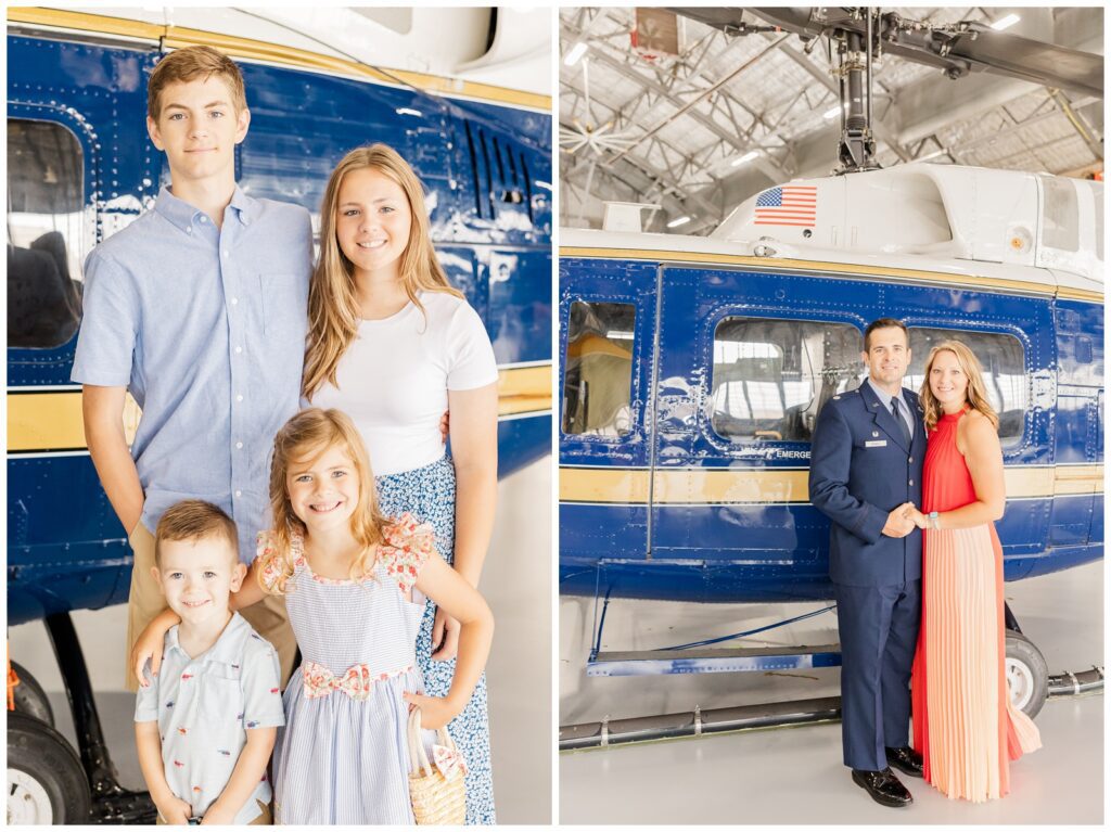 Families posing with a helicopter
