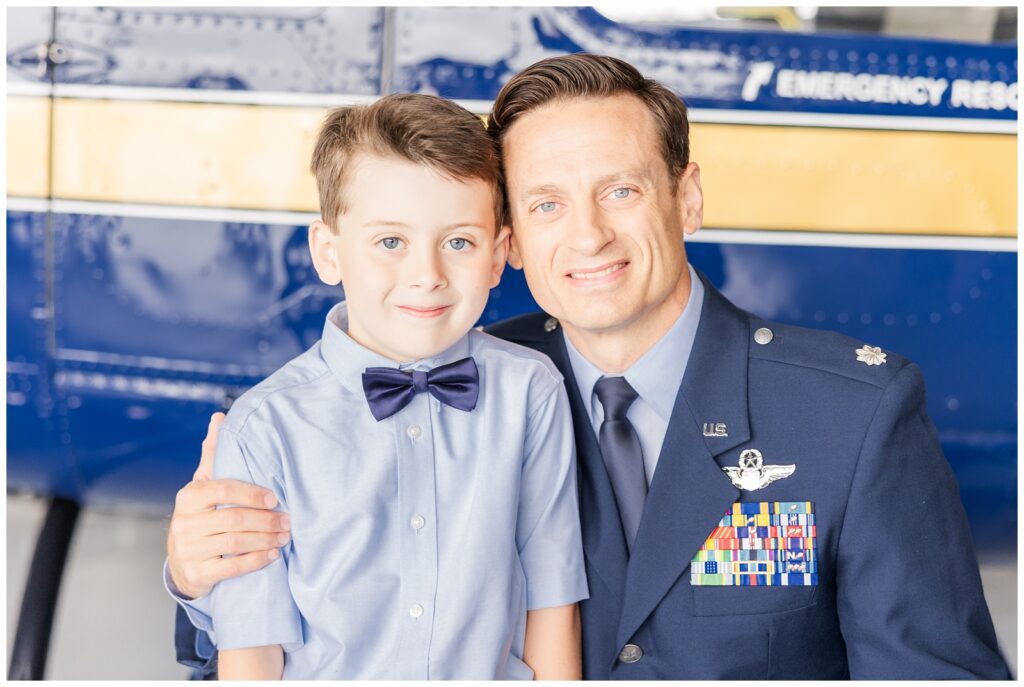 Father and son in front of a helicopter