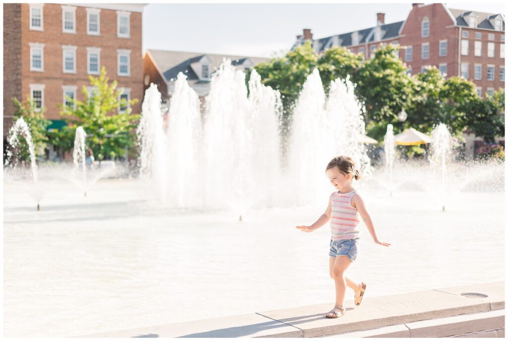 Little girl walking near Fountain Square in Old Town Alexandria