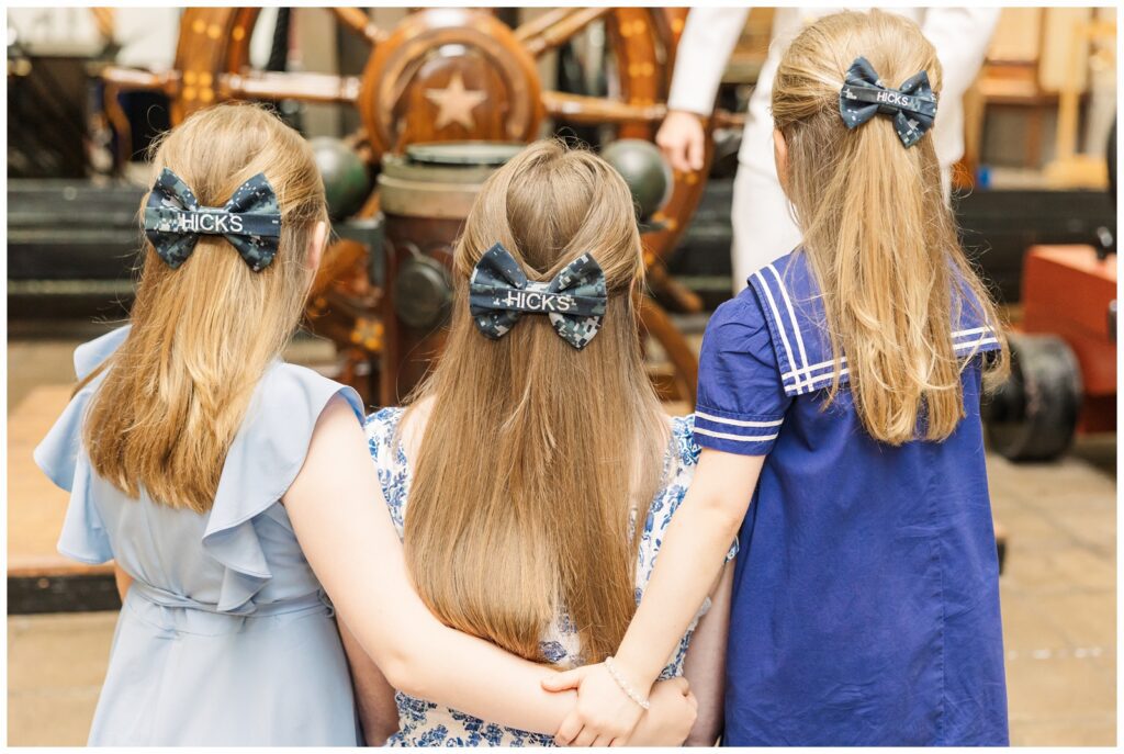 Hicks sisters wearing their matching Navy bows