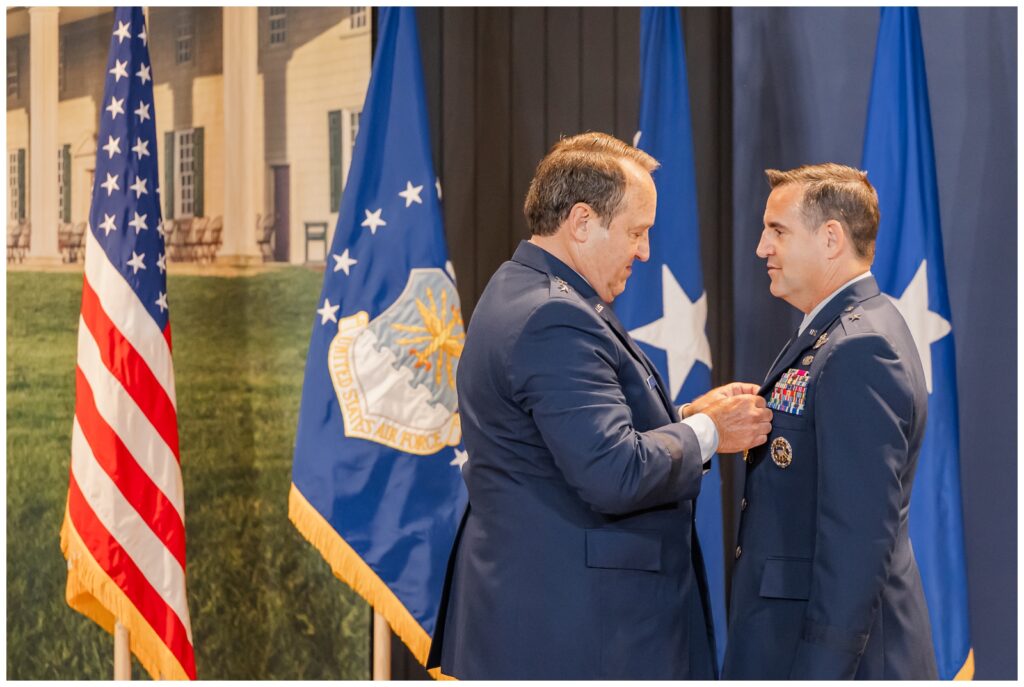 Lt Gen giving Distinguished Service Medal to Brig Gen at Air Force retirement ceremony