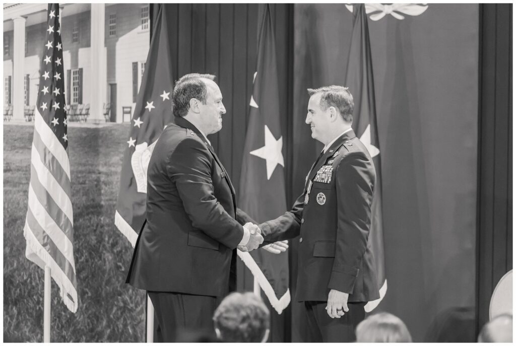 AF officers shake hands during Air Force retirement ceremony