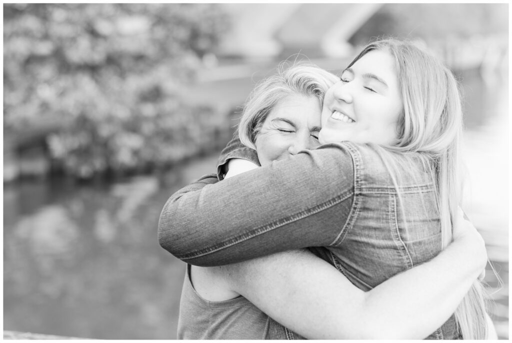 Black and white image of Mom and daughter hugging
