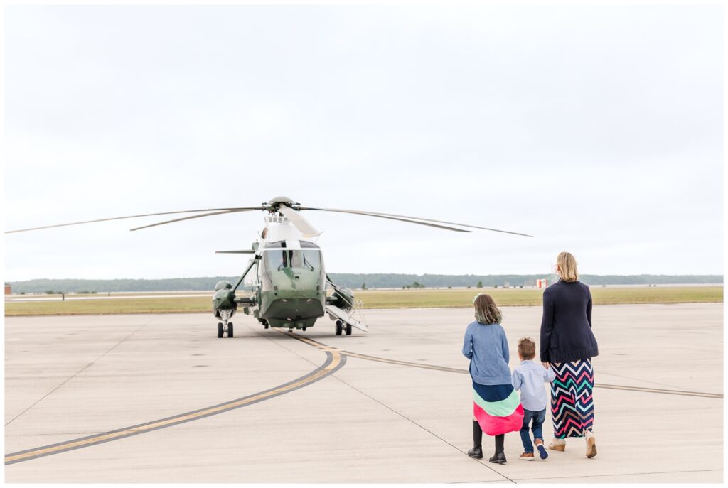 Mom and children walking towards a helicopter