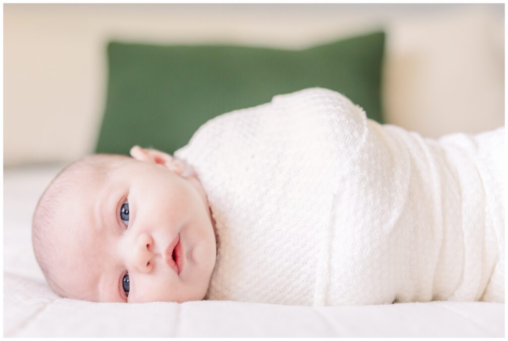 Newborn laying with open eyes at his DC newborn photography session