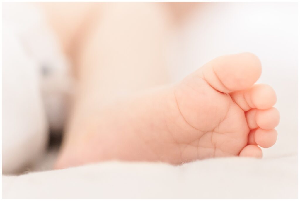 Close up shot of baby toes during lifestyle newborn photography session