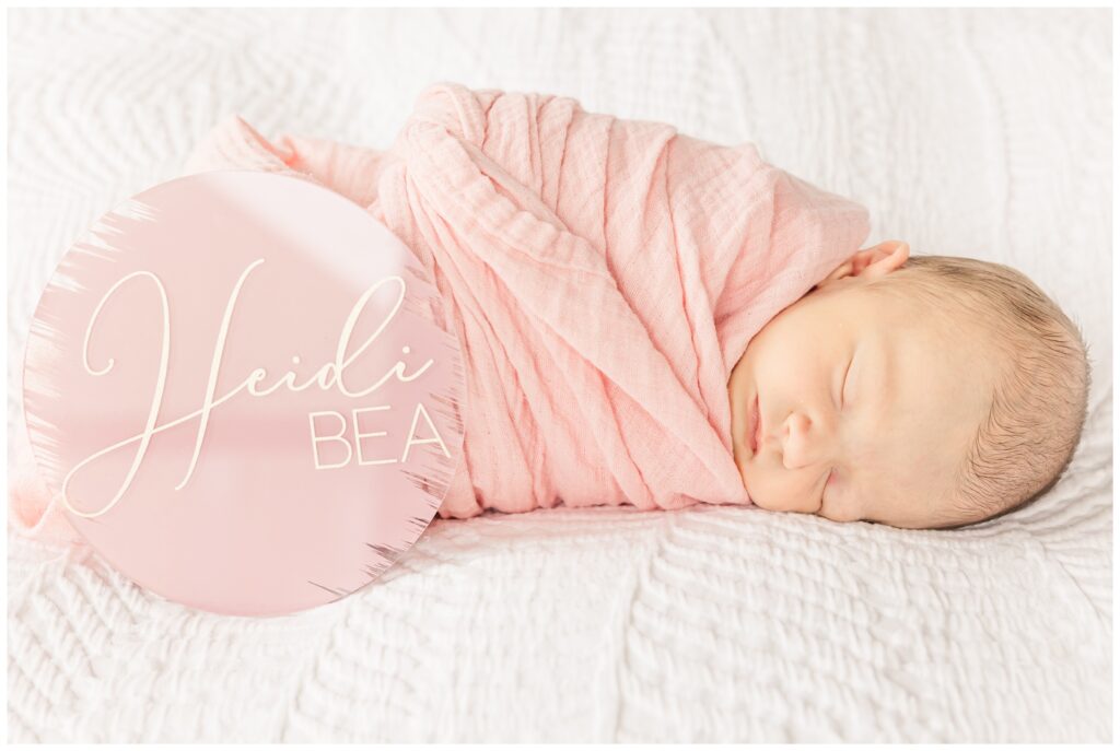 Sleeping baby girl with her name plate during her Old Town Alexandria newborn photography session