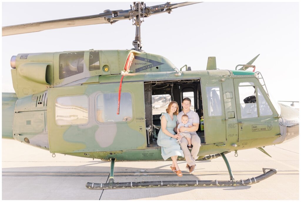 Air Force family posing in a helicopter; taken with the Canon RF 28-70mm f/2.0