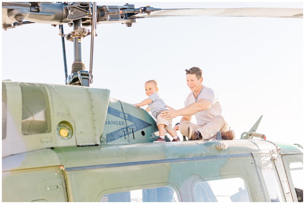 Father and son sitting on top of a helicopter; image taken with Canon RF 28-70mm f/2.0