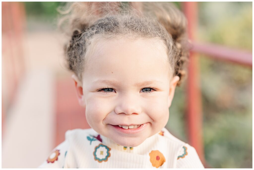 Close up of toddler girl smiling