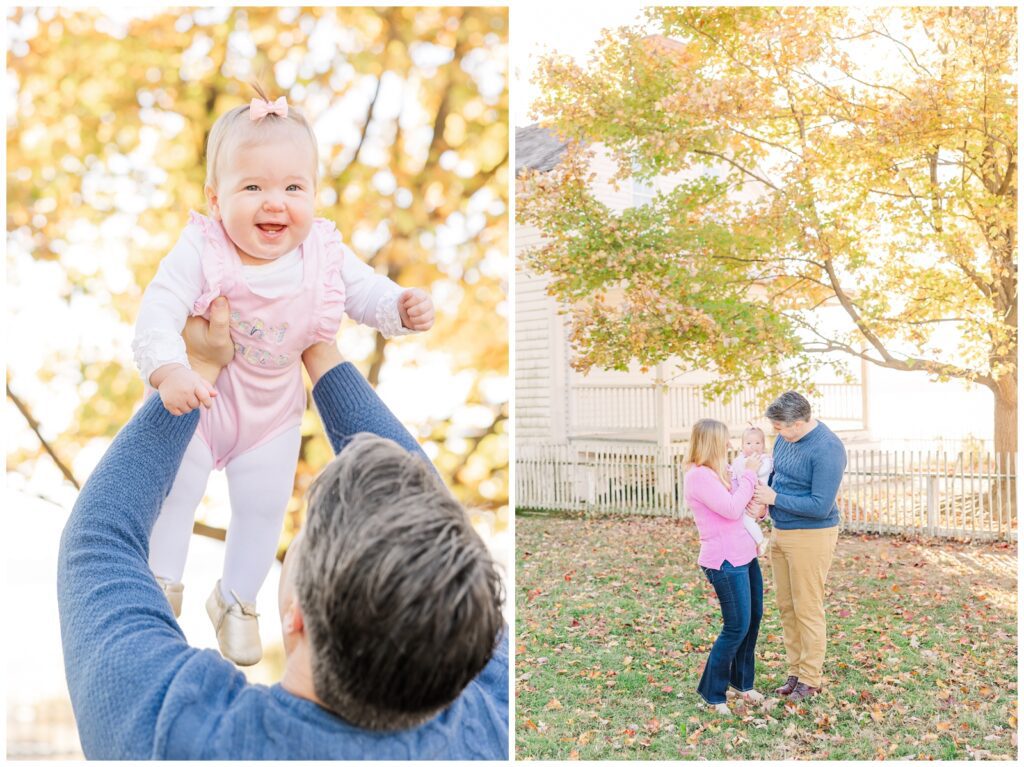 Dad tossing toddler daughter in the air among beautiful fall trees