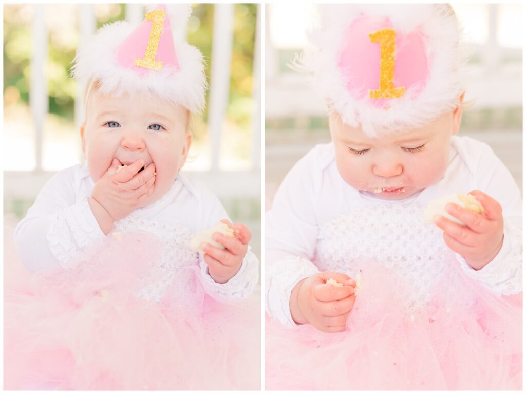 Toddler in pink birthday clothes eating cake