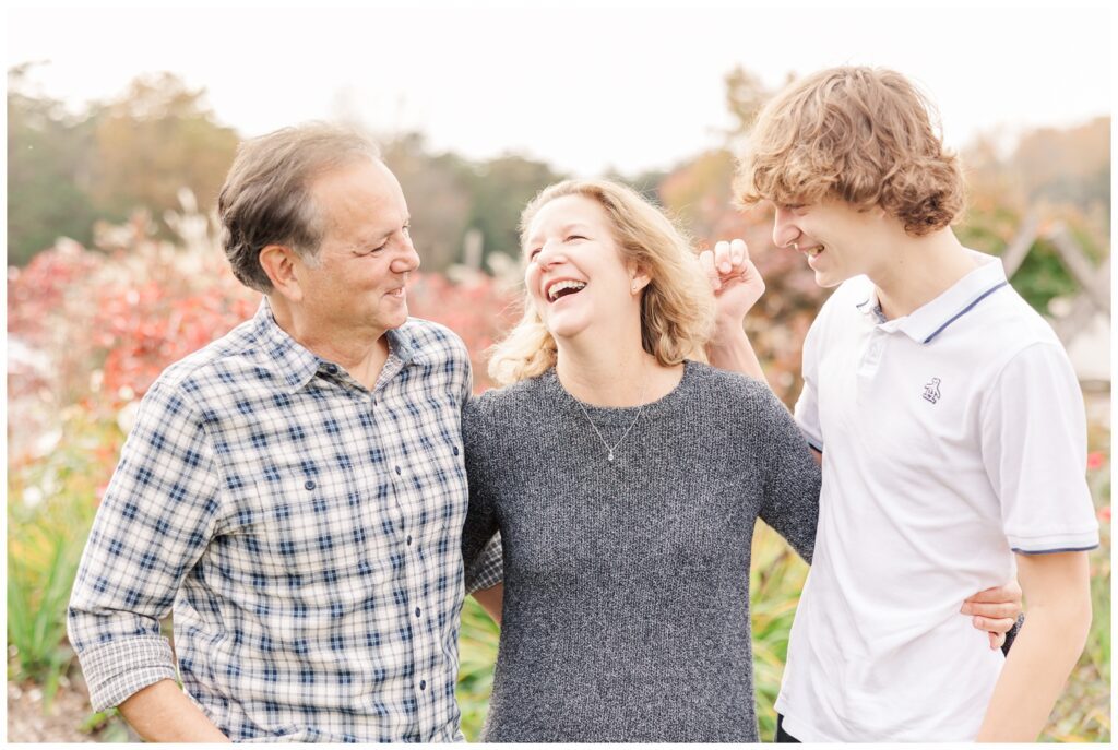 Family laughing during a fall mini session