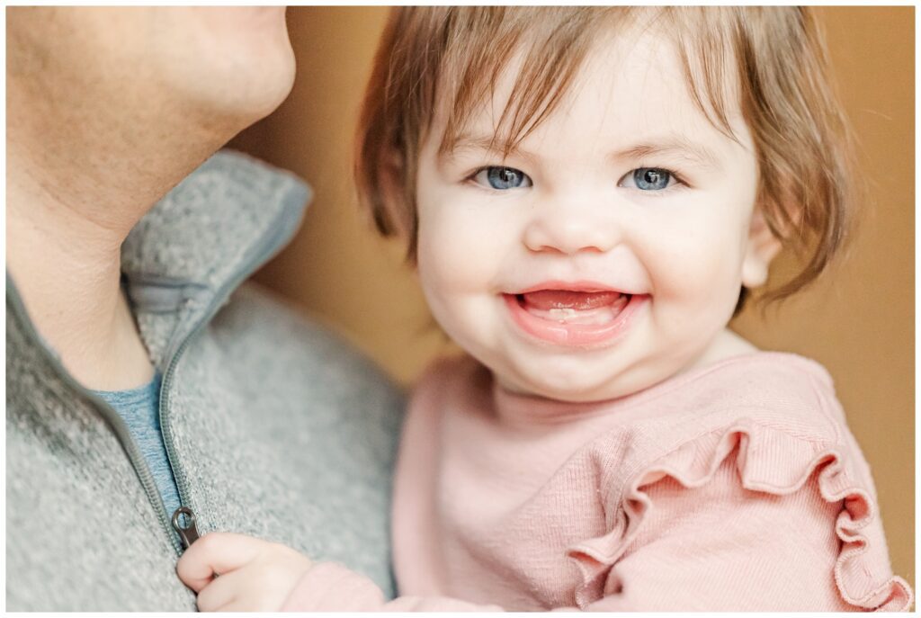 Close up of blue-eyed toddler smiling