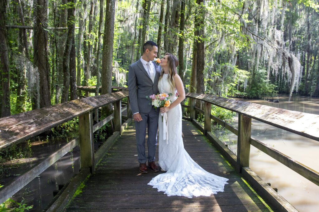 Bride and groom at Swan Lake Iris Gardens in K. Z. Wentzel's Sumter, SC photography spotlight