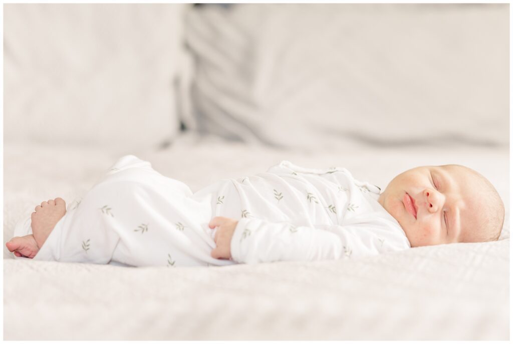 Sleeping newborn baby boy during lifestyle newborn session