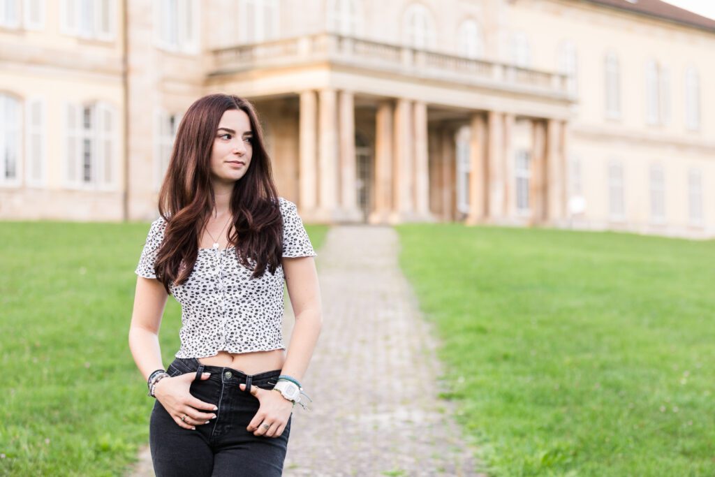 Teenage girl standing in front of a building at The University of Hohenheim in Joanie Zipperer Photography's Stuttgart, Germany photography spotlight
