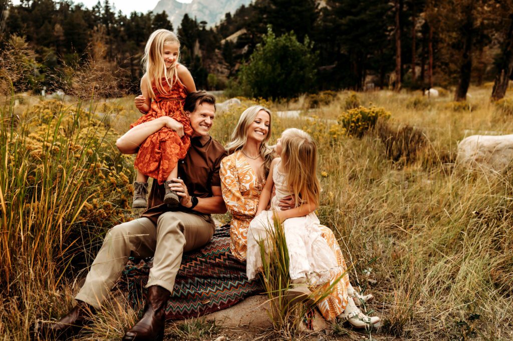 Parents with their daughters at Viestenz-Smith Park in Christa Paustenbaugh's Cheyenne, WY photography spotlight