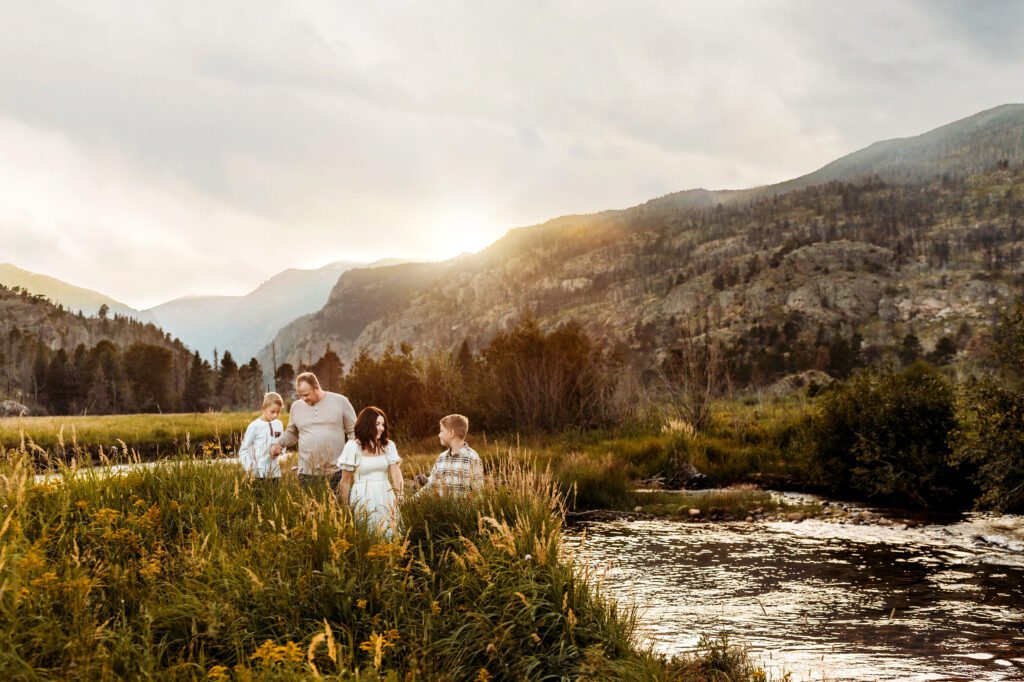 Family standing in Rocky Mountain National Park in Christa Paustenbaugh's Cheyenne, WY photography spotlight