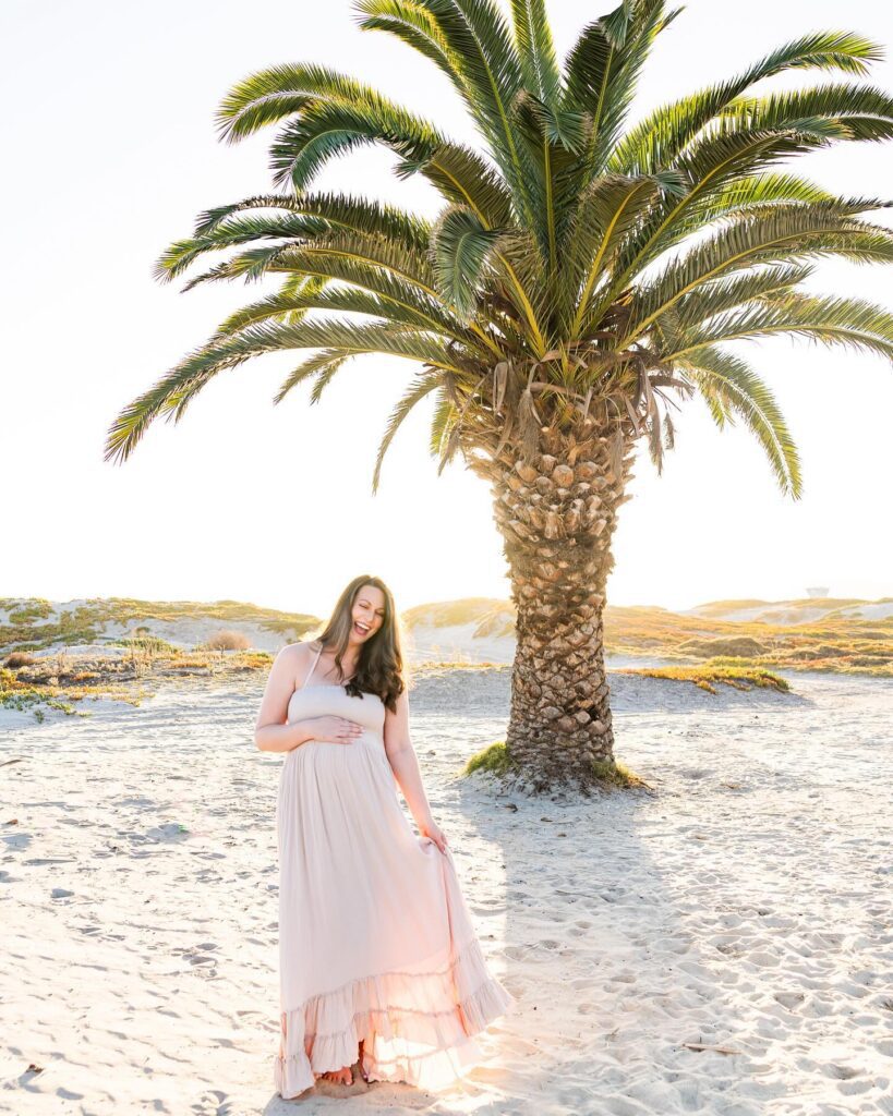 Pregnant mama standing in front of a palm tree at Coronado Beach in Jen Jordan's MCAS Miramar photography spotlight