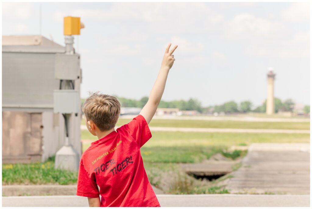 Boy counting down how many planes have landed