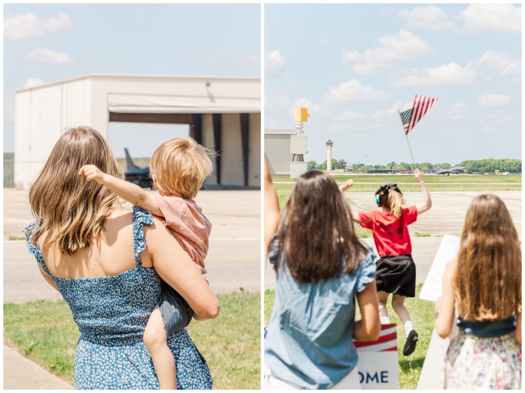 Mom holding her son near the flight line as his dad lands after a deployment