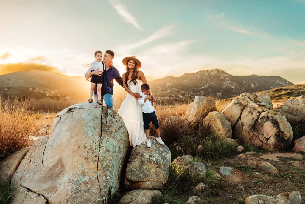 Family standing on rocks at Lake Hodges in Christa Paustenbaugh Photography's Oceanside, CA Photography Spotlight