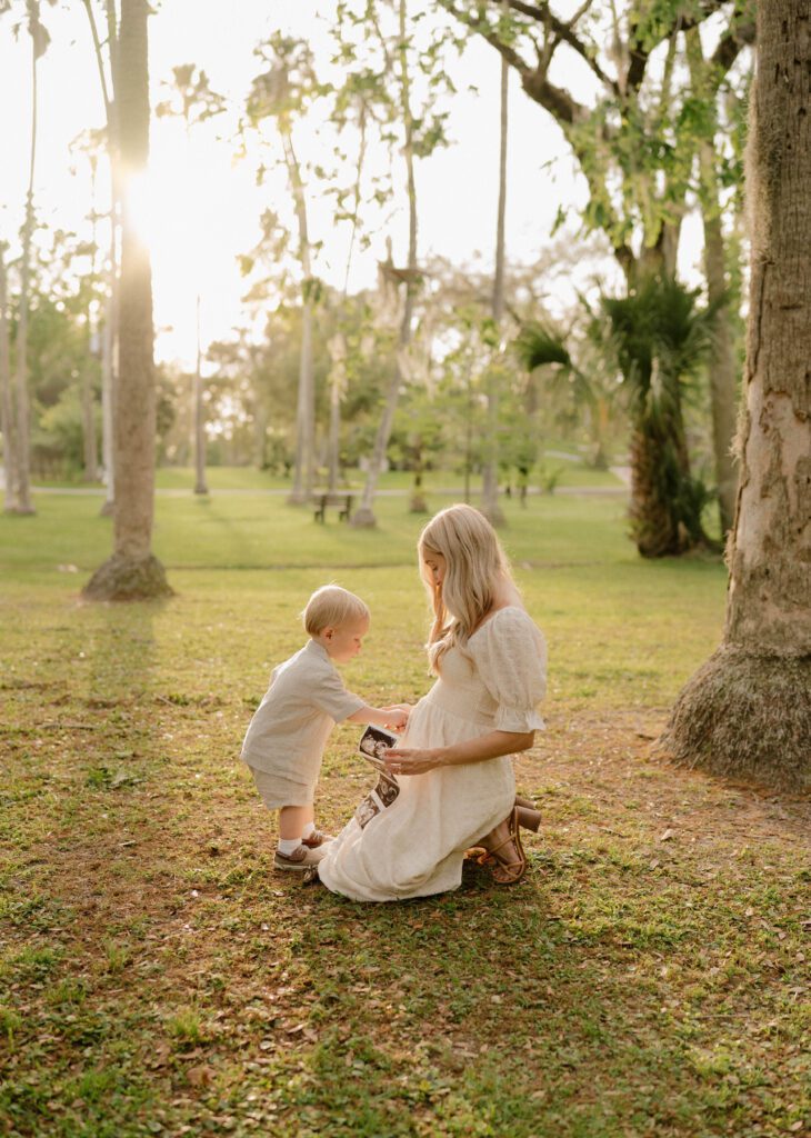 Pregnant mama sitting with her toddler in Johansen Park in Jordan M Photo's Jacksonville, FL Photography Spotlight