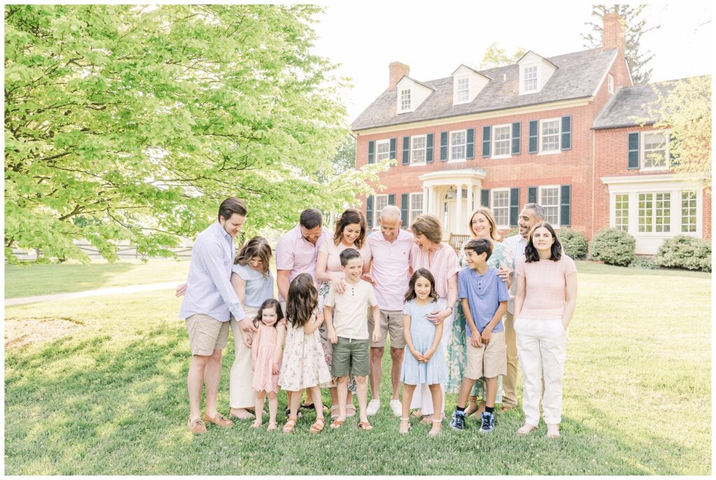 Family laughing at Woodlawn Manor Cultural Park during Maryland extended family photos