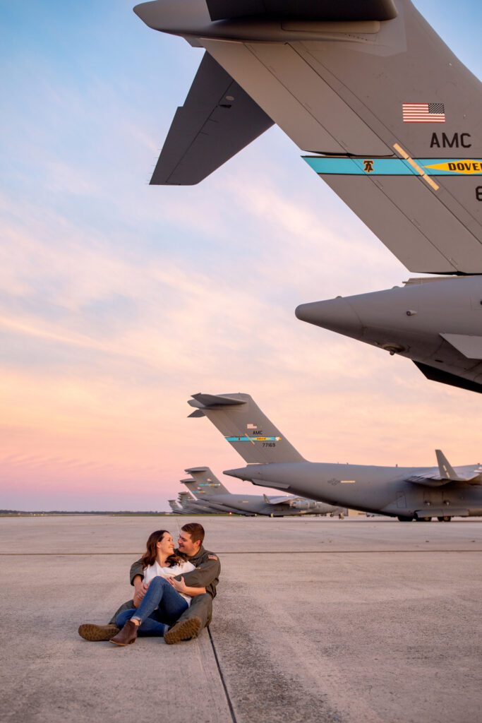 Couple sitting on the Dover AFB flight line at sunset in Megan Leigh Acosta's Dover, DE Photography Spotlight