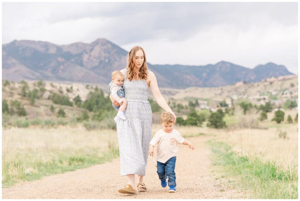Mom walking with her babies at Ute Valley Park in Colorado