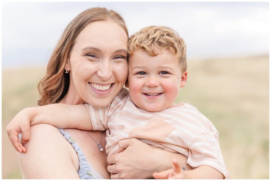 Close up of mom and toddler smiling and laughing