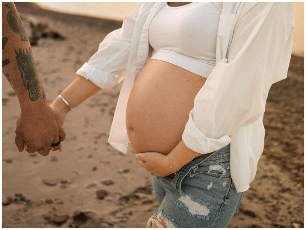Close up belly shot of a pregnant mama at Hamlin Beach State Park in On Cloud Cline Photography's Webster, NY photography spotlight