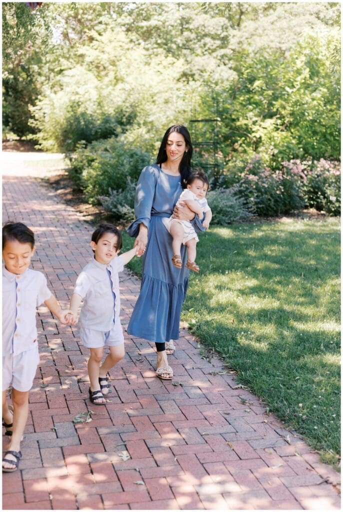 Mom walking with her three kids at Luthy Botanical Gardens in Victoria Mendoza Photography's Peoria, IL photography spotlight