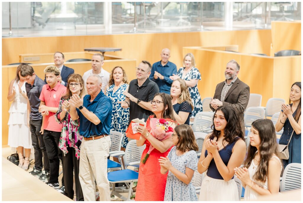 Air Force retiree receiving a standing ovation at a USAFA photography session
